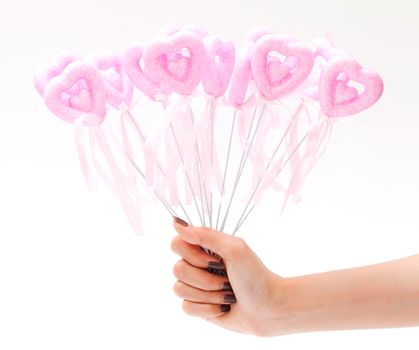 pink heart in hand on white background