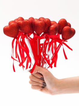 red heart in hand on white background