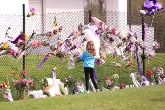 MINNESOTA, Chanhassen: Fans pay their respects outside the Paisley Park residential compound of music legend Prince in Chanhassen, near Minneapolis, Minnesota, on April 21, 2016. Emergency personnel tried and failed to revive music legend Prince, who died April 21, 2016, at age 57, after finding him slumped unresponsive in an elevator at his Paisley Park studios in Minnesota, the local sheriff said.