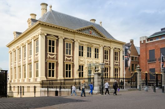 The Hague, Netherlands - May 8, 2015: Tourist visit Mauritshuis Museum in The Hague, Netherlands. The museum houses the Royal Cabinet of Paintings which consists of 841 objects, mostly Dutch Golden Age paintings.