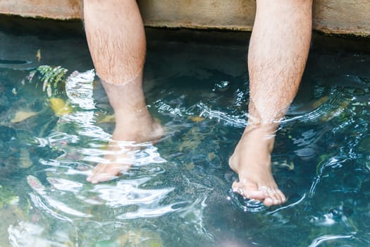 Foot onsen in hot spring water.