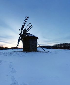 Old wooden windmills at Pirogovo ethnographic museum, near Kiev, Ukraine