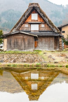Reflect of house at Shirakawago in water.
