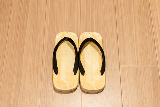 Zori sandal on wooden floor.