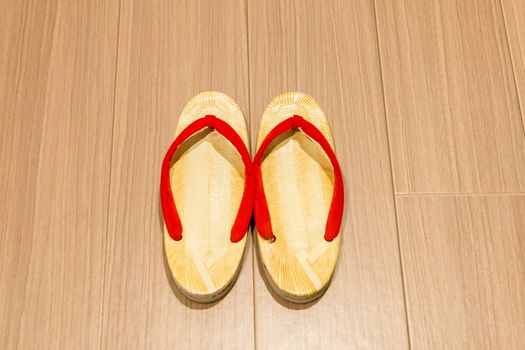 Zori sandal on wooden floor.