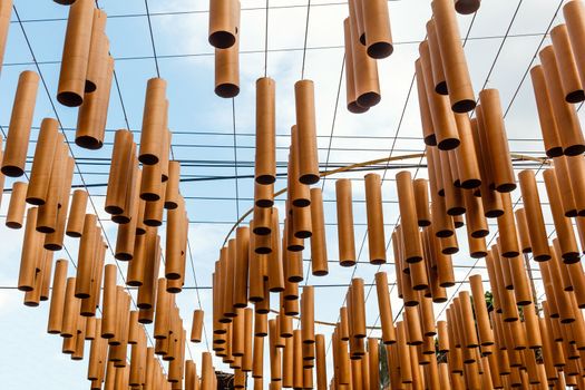 Wooden mobile hanging at Jim Thompson farm, Thailand.