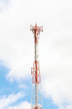 Radio tower with blue sky and cloud.