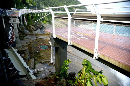 BRAZIL, Rio de Janeiro: View of a bike path after it collapsed, in Rio de Janeiro, on April 21, 2016. Inaugurated in January, the track was hit by strong waves. Two people were killed in the accident and one remains disappeared.