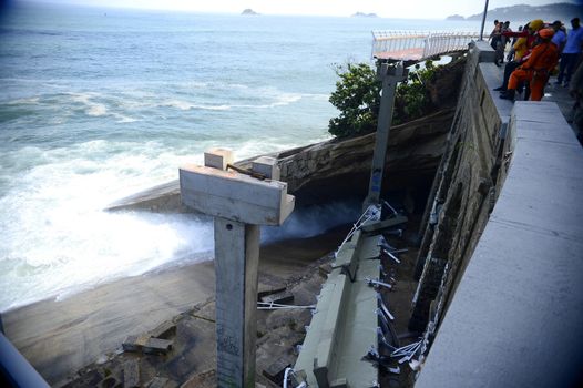 BRAZIL, Rio de Janeiro: View of a bike path after it collapsed, in Rio de Janeiro, on April 21, 2016. Inaugurated in January, the track was hit by strong waves. Two people were killed in the accident and one remains disappeared.