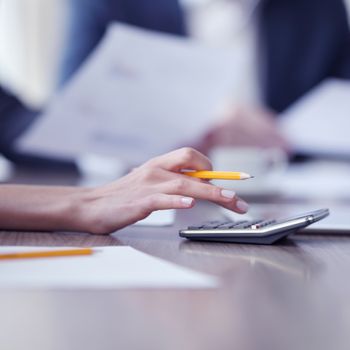 Close-up of Business people working together at meeting