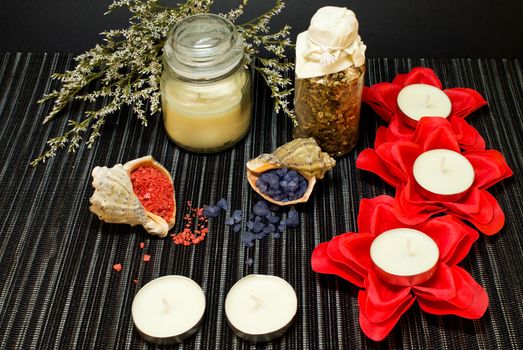 Still life of tools for massage and bath salts in shells