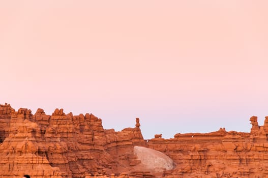 A colorful sunset over a cliff face in Moab, Utah