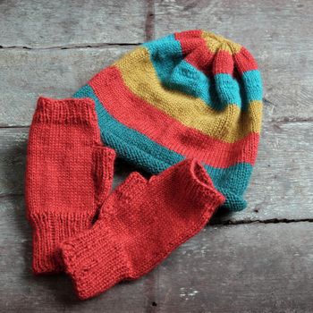 Handmade gift for winter, knitted gloves and knit hat for cold day, group of colorful yarn make warm, knit accessories is hobby activity of woman