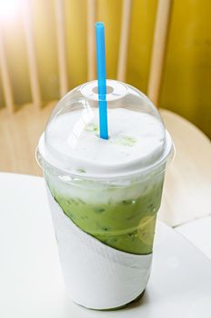 ice milk green tea matcha on table.