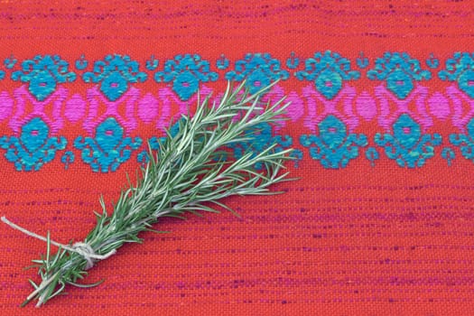 Rosemary herb (Rosmarinus officinalis ). Bunch of fresh rosemary on folk background