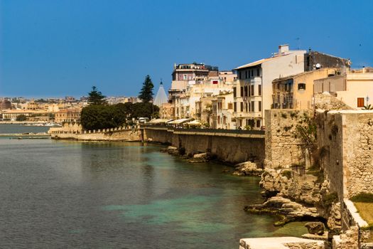 The city of Siracusa in Sicily, blue bay.