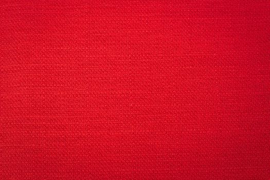 Rustic canvas fabric texture in red color.