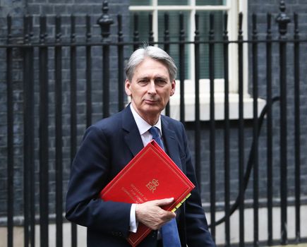 UNITED-KINGDOM, London: British minister of Foreign affairs Philip Hammond stands as President Barack Obama is about to greet British Prime Minister David Cameron at Downing Street on April 22, 2016 in London, United-Kingdom. The President and his wife are currently on a brief visit to the UK where they will have lunch with HM Queen Elizabeth II at Windsor Castle and dinner with Prince William and his wife Catherine, Duchess of Cambridge at Kensington Palace. 