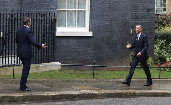 UNITED-KINGDOM, London: President Barack Obama (R) greets British Prime Minister David Cameron (L) as they meet at Downing Street on April 22, 2016 in London, United-Kingdom. The President and his wife are currently on a brief visit to the UK where they will have lunch with HM Queen Elizabeth II at Windsor Castle and dinner with Prince William and his wife Catherine, Duchess of Cambridge at Kensington Palace. 