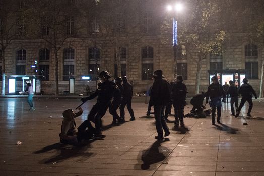 FRANCE, Paris: Nuit Debout protesters face riot police officers on the Place de la République in Paris during violent protests following the Nuit Debout (Up All Night) movement rally, on April 23, 2016. The Nuit Debout or Up All Night protests began in opposition to the Socialist government's labour reforms seen as threatening workers' rights, but have since gathered a number of causes, from migrants' rights to anti-globalisation.