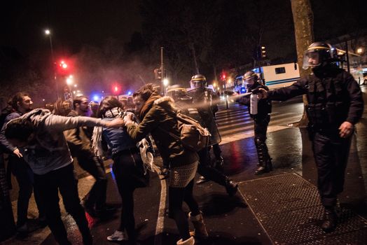 FRANCE, Paris: Riot police fases Nuit Debout protesters  on the Place de la République in Paris during violent protests following the Nuit Debout (Up All Night) movement rally, on April 23, 2016. The Nuit Debout or Up All Night protests began in opposition to the Socialist government's labour reforms seen as threatening workers' rights, but have since gathered a number of causes, from migrants' rights to anti-globalisation.