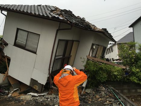 JAPAN, Mashiki: A man is pictured in front of the rubble of a collapsed house following an earthquake, on April 23, 2016 in Mashiki near Kumamoto, Japan. As of April 20, 48 people were confirmed dead after strong earthquakes rocked Kyushu Island of Japan. Nearly 11,000 people are reportedly evacuated after the tremors Thursday night at magnitude 6.5 and early Saturday morning at 7.3.