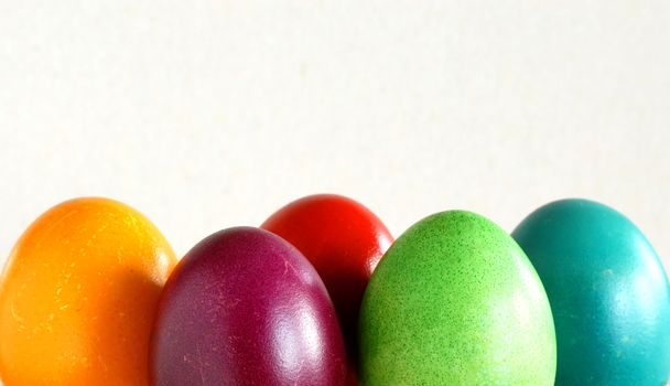 many various colorful easter eggs in row background