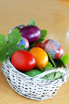 various colorful easter eggs in small punnet
