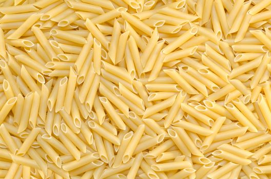 Background tubular pasta are on the surface, textured