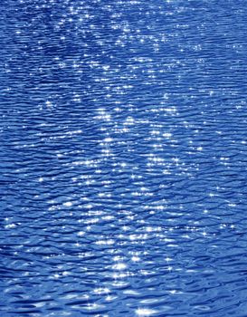 Water surface in Karpin pond in which the sun is reflected. City Gatchina Leningrad Region, Russia.