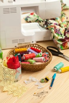 the sewing machine with a measuring tape and accessories costs on a table