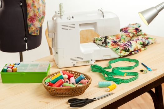 the sewing machine costs on a table near a dummy