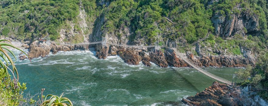 STORMS RIVER MOUTH, SOUTH AFRICA - FEBRUARY 29, 2016:  An aerial view of the three suspension bridges at the Mouth of the Storms River