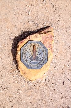 Sun dial on rock in the Arizona desert
