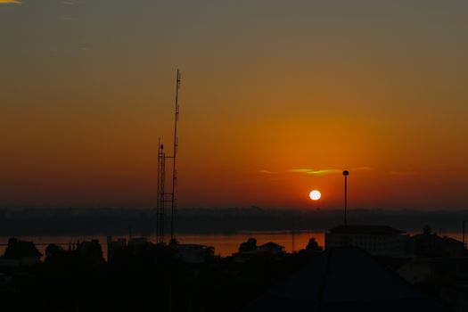 Sunrise over Mekong River in a Mukdahan city skyline