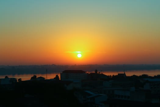 unrise over Mekong River in a Mukdahan city skylin