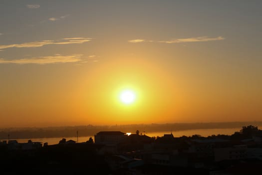 Sunrise over Mekong River in a Mukdahan city skyline