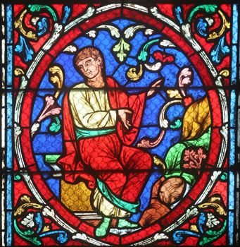 Colorful stained glass window in Cathedral Notre Dame de Paris