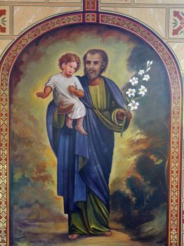 Saint Joseph holding baby Jesus