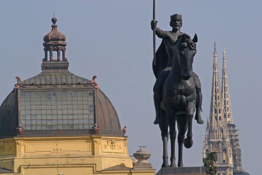 Three landmark or sign in Zagreb, King Tomislav statue, Art pavilion roof and cathedral tower.