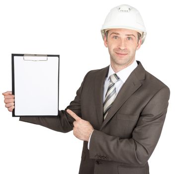 Smiling businessman in helmet holding folder isolated on white background