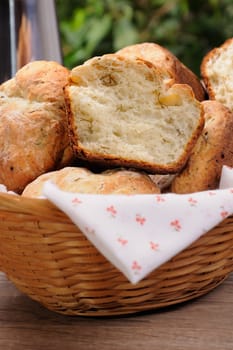 Homemade buns with cottage and dill in a basket