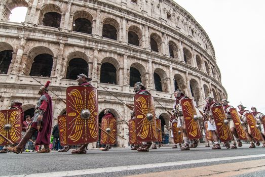 ITALY, Rome: Men dressed as ancient roman centurions parade near the Colosseum to commemorate the legendary foundation of the eternal city in 753 B.C, in Rome on April 24, 2016. 