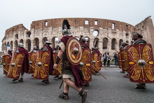 ITALY, Rome: Men dressed as ancient roman centurions parade near the Colosseum to commemorate the legendary foundation of the eternal city in 753 B.C, in Rome on April 24, 2016. 