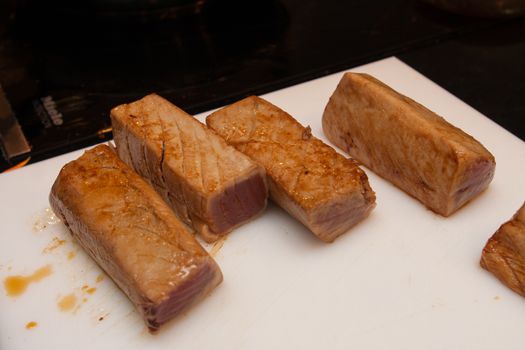 fried tuna slices on plastic platter