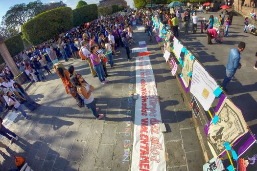 MEXICO, Morelia: Hundreds demonstrate against sexual violence to women and hold placards reading Vivas Nos Queremos, or We want to live at Plaza Benito Juarez, in Morelia, central Mexico, on April 24, 2016 as a group of women in Mexico have launched few days earlier a social media campaign encouraging people to speak out against sexual assault under the hashtag #NoTeCalles, or Don't Stay Silent. In June 2015, UN officials has said Mexico ranks among the world's 20 worst countries for violence against women. Several cities in the country held similar protest. 