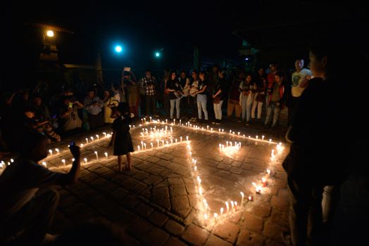 NEPAL, Patan: Nepalese residents gather to light candles during a vigil to mark the first anniversary of a devastating earthquake in Durbar Square in Patan, Kathmandu valley on April 24, 2016. Nepal on April 24 held services remembering thousands of people killed in a devastating earthquake one year ago, as authorities vow to expedite long-delayed reconstruction projects. Some 9,000 people were killed in the 7.8-magnitude quake that struck April 25, 2015 and its aftershocks.