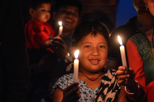 NEPAL, Patan: Nepalese residents gather to light candles during a vigil to mark the first anniversary of a devastating earthquake in Durbar Square in Patan, Kathmandu valley on April 24, 2016. Nepal on April 24 held services remembering thousands of people killed in a devastating earthquake one year ago, as authorities vow to expedite long-delayed reconstruction projects. Some 9,000 people were killed in the 7.8-magnitude quake that struck April 25, 2015 and its aftershocks.