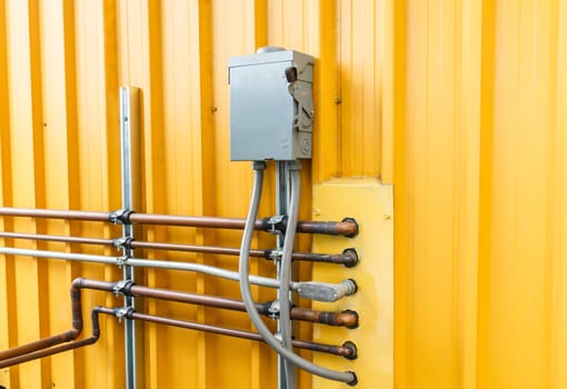 Electric safety switch with yellow background.