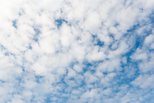 Cloudy day with blue sky.